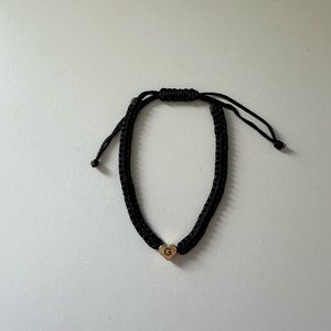Black bracelet with Gold G